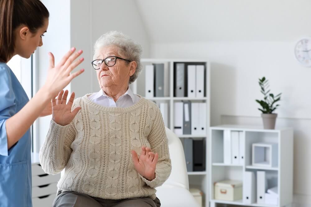An elderly woman suffering from abuse in a nursing home in Alabama.