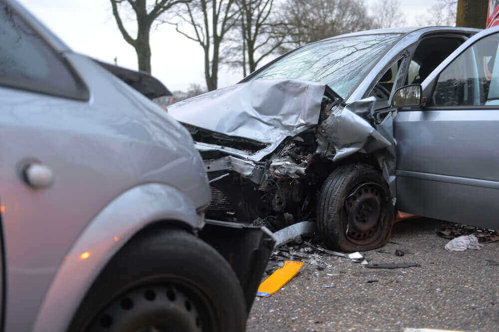 Damaged cars in highway from car accident.