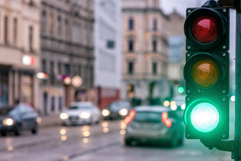 Traffic light in green signaling go for the vehicles.